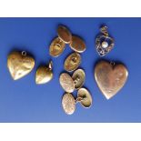 A pair of 9ct cufflinks, one other pair and four heart pendants.