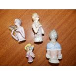 Four porcelain half-dolls.