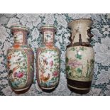 A small pair of 19thC Cantonese famille rose rouleau vases, 7.25” and one other. (3)