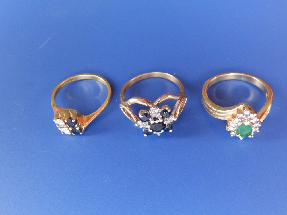 Two modern sapphire & diamond rings and a cluster ring. (3)