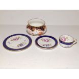 A miniature Coalport cup, saucer and tea plate, together with a Royal Crown Derby bowl. (4)