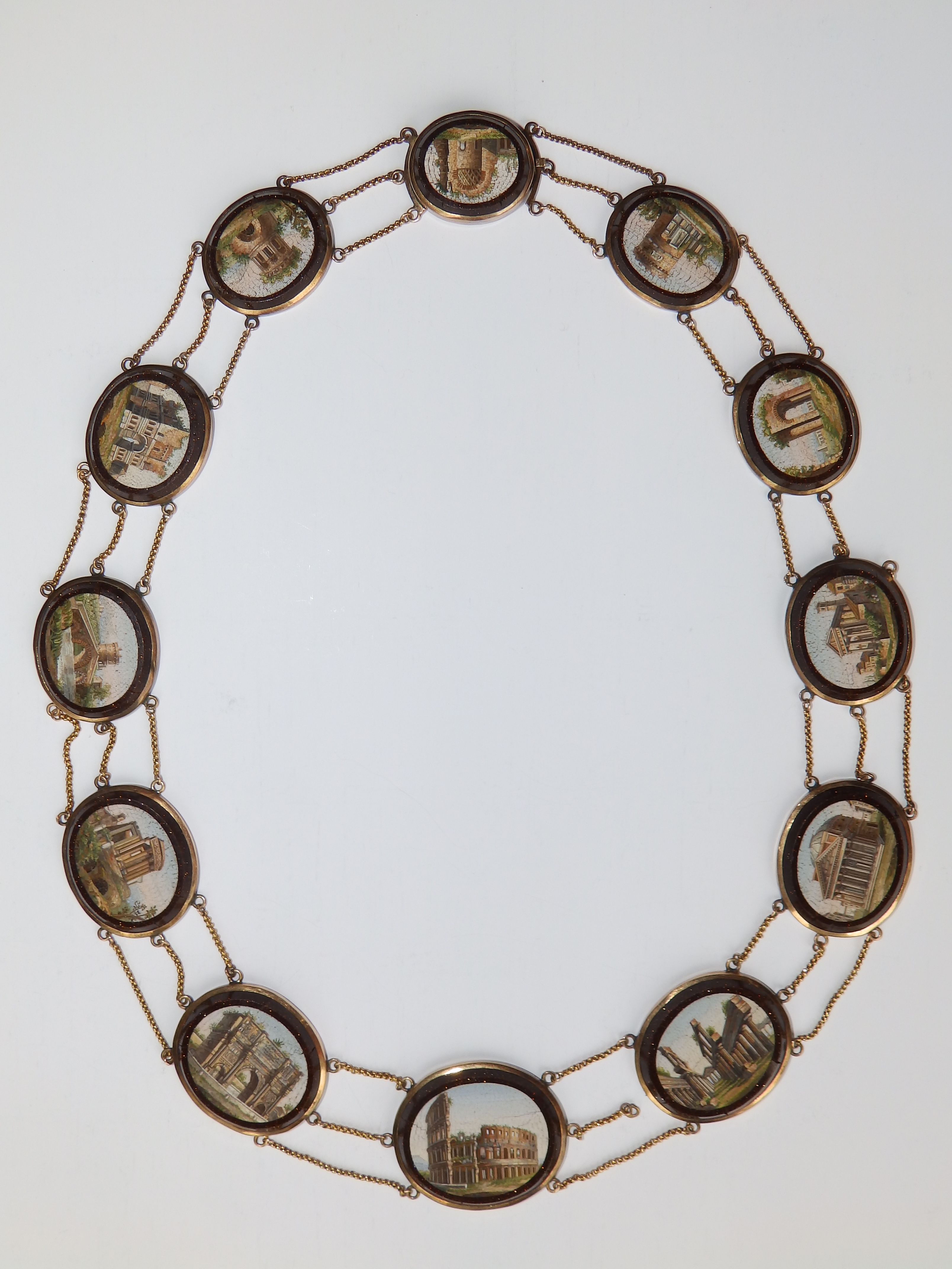 An early 19thC Italian micro-mosaic 'Grand Tour' gold necklace, comprising 12 graduated oval