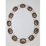 An early 19thC Italian micro-mosaic 'Grand Tour' gold necklace, comprising 12 graduated oval