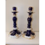 A pair of 19thC Meissen porcelain dark blue & gilt candlesticks – one sconce damaged, 11” high.