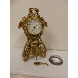 A small art nouveau gilt metal mantel clock fitted with modern quartz movement – case a/f.