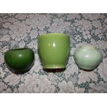 Two plain green glazed Wemyss bowls, the larger 4” high and one other. (3)