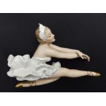 A 20thC German porcelain seated ballerina.