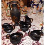 A black basaltes ware vase and five jugs – a/f. (6)