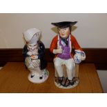 A 19thC seated sailor toby jug and one other – both a/f.