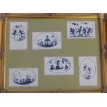 A framed panel containing six silhouette postcards after Margaret Tarrant.