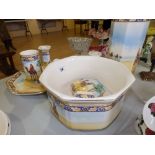 An eight piece Falcon Ware dressing table set decorated with an arab on a camel pattern.