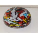 A scrambled cane glass paperweight.