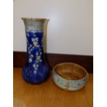 A Royal Doulton stoneware vase and a Royal Doulton Lambeth bowl. (2)