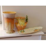 A Burleigh Ware pixie vase, a Shelley vase and a Royal Staffordshire tray. (3)