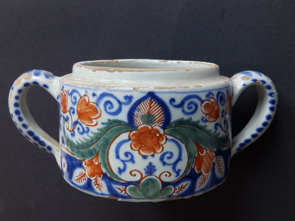 An 18thC two-handled faience jar, decorated flowers and arabesque scrolls in iron red, green & blue, - Image 2 of 4