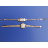 A lady's 9ct gold art deco bracelet wrist watch and one other lady's gold watch on a plated