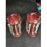 A pair of cranberry glass lustres, 13” high.