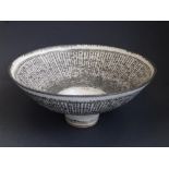 Dame Lucie Rie (1902-1995) – a stoneware bowl, the flared sides glazed in grey/cream glaze with a