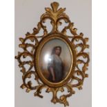 A 19thC continental oval porcelain plaque painted with a portrait of Ruth holding a corn sheaf, 5”