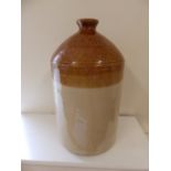 A WWI SRD Fulham Pottery rum jar together with an advertising jar for Burnett, Wine Merchants,