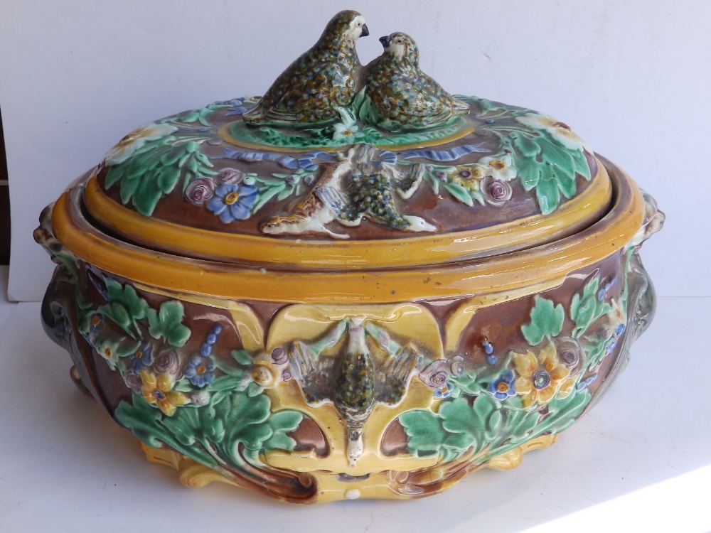 A Wedgwood majolica game pie dish with cover & liner, decorated grouse – cracked, 10.5” across.