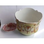 A Crown Devon jardiniere – cracked, together with a Burleigh Ware soap dish. (2)
