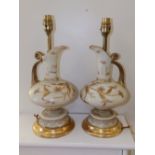 A pair of gilded opaque glass ewers – one a/f.