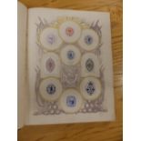 Four albums of postage stamps together with an album of crests and monograms.