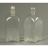 A pair of 18th century square section decanters, each with circular stopper. Height 30 cm.