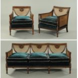 An Edwardian mahogany Bergere lounge suite, comprising settee and two chairs,
