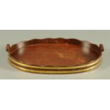 A George III style brass bound mahogany veneered tray. Width 56 cm.