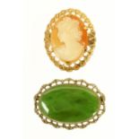 A rolled gold cameo brooch, and jade brooch.