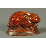 A rare 19th century North Country salt glazed rabbit money box, circa 1850. Length 11.5 cm.