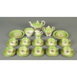 A late Victorian green white and gilt tea set, Rockingham style and with foliate pattern,