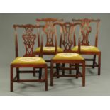 Four 19th century Chippendale style side chairs, each with yoke shaped top rail, pierced splat back,