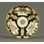 A Worcester Scale Blue porcelain lobed dish, decorated with flowers. Diameter 19 cm.