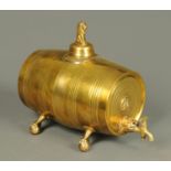 A Victorian brass keg, with tap and raised on four short claw and ball feet. Length 30 cm.