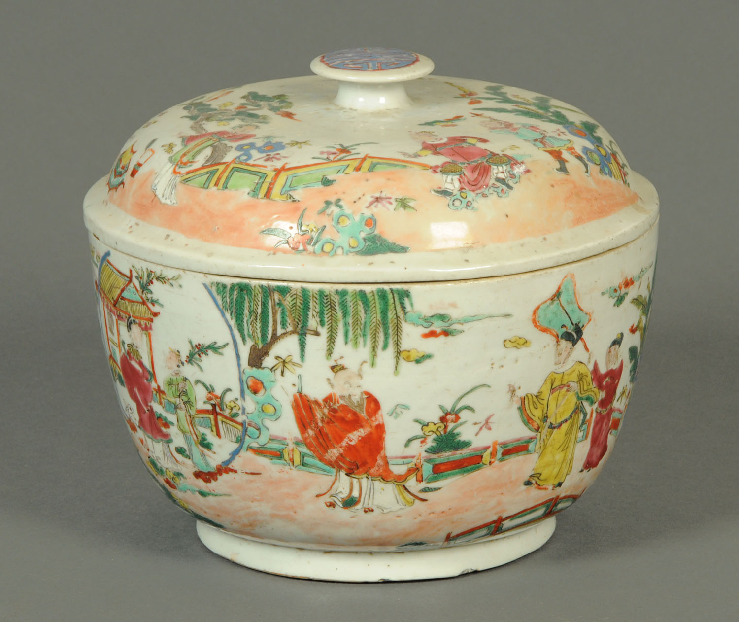 A large 19th century Chinese bowl and cover, decorated with figures.