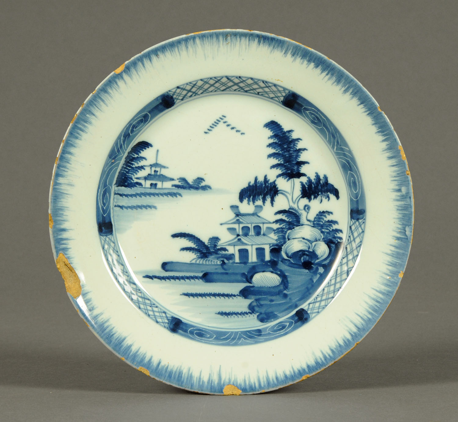 Three 18th century Delft tin glazed plates, polychrome and two underglaze blue. - Image 2 of 3