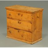 A Queen Anne pine chest of three drawers. Width 76 cm.