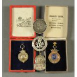 A silver football medal, three other medals and an 1887 half crown brooch.