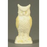 A Belleek spill holder, in the form of an owl. Height 20.5 cm.