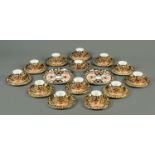 A Royal Crown Derby tea service, comprising 2 large serving plates, 12 plates, 12 saucers,