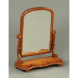 A Victorian mahogany framed dressing table mirror, with serpentine base. Width 59 cm.