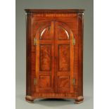 A 19th century mahogany floor standing corner cabinet,