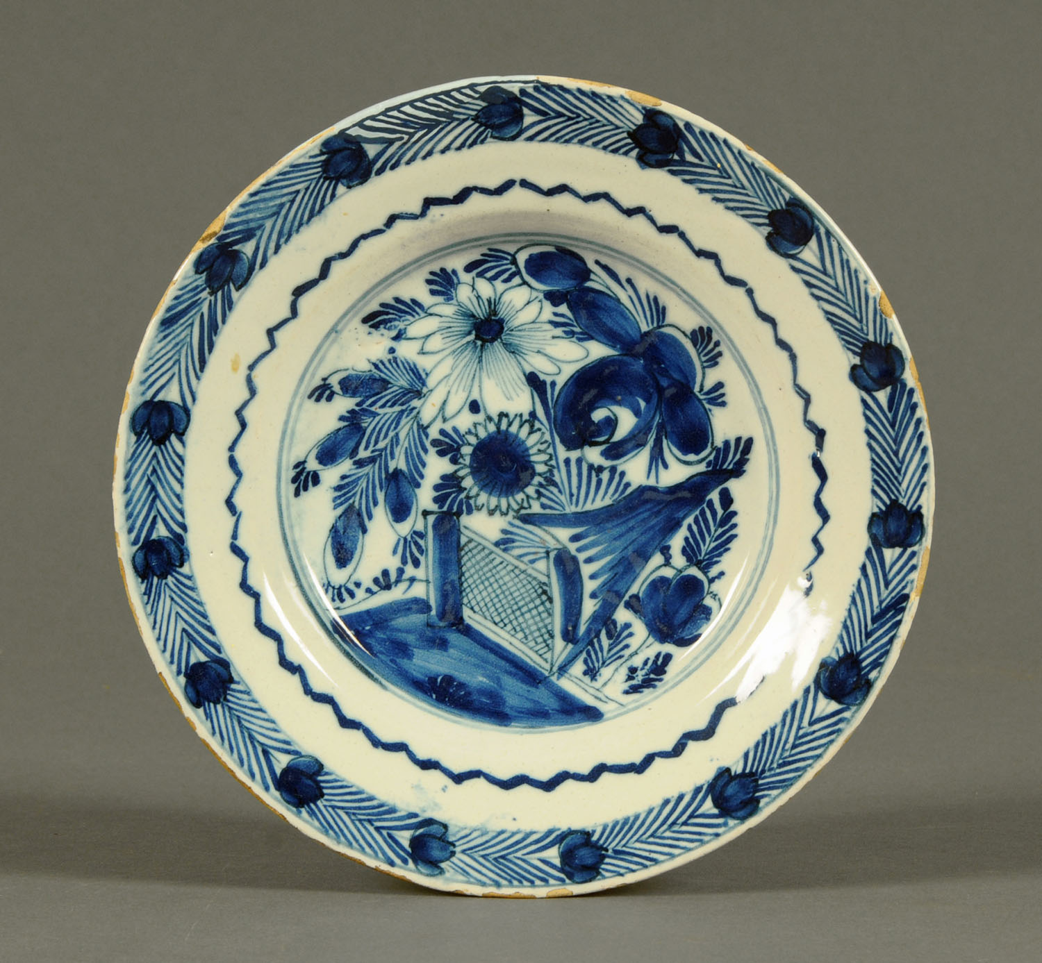 Three 18th century Delft tin glazed plates, polychrome and two underglaze blue. - Image 3 of 3