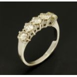 An 18 ct gold five stone diamond ring, +/- 1 carat in total, size K.