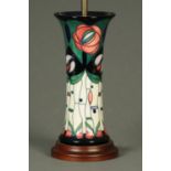 A Moorcroft table lamp, with stylised tube lined design. Height excluding light fitting 28 cm.