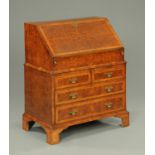 An antique burr elm bureau,