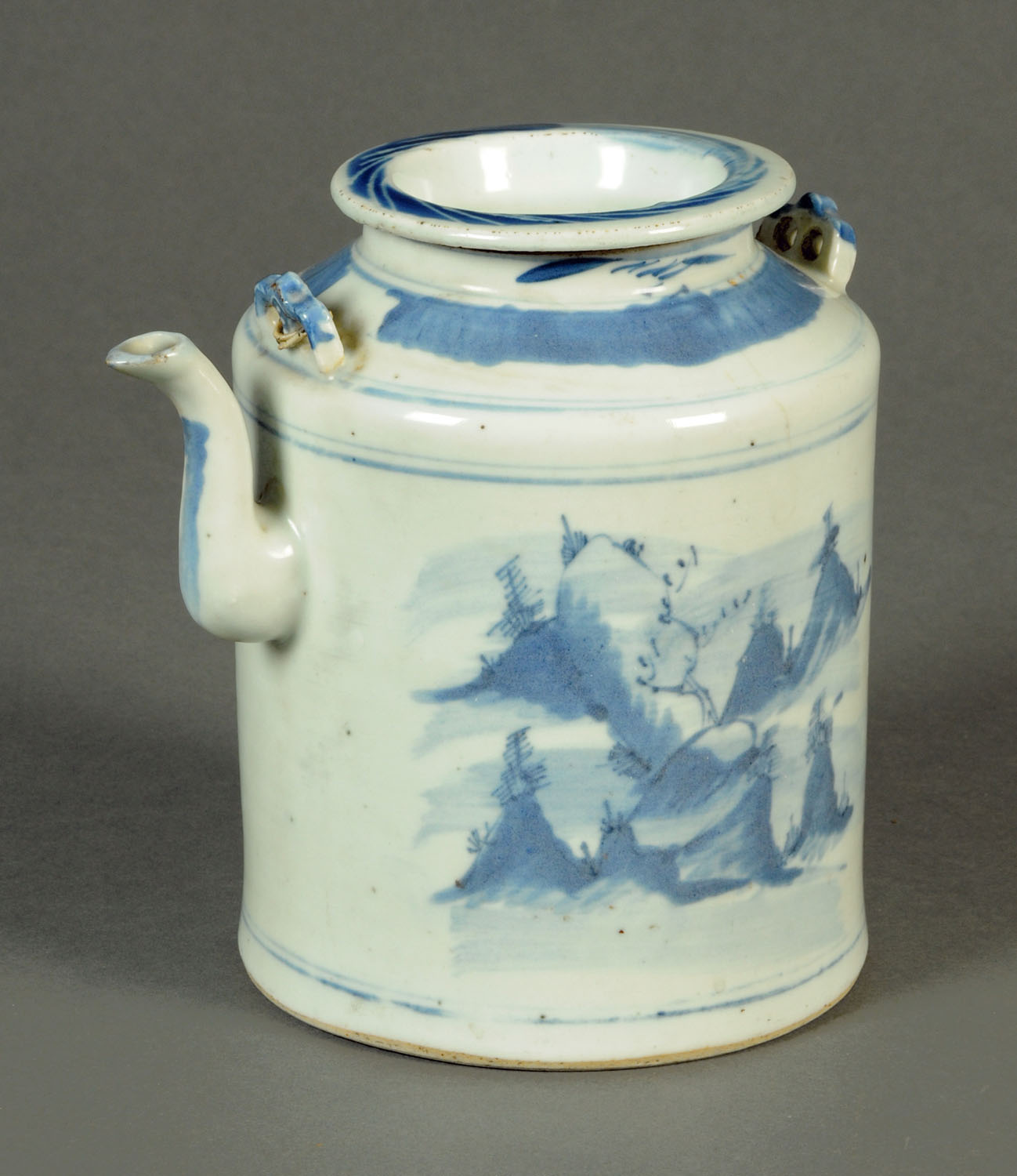 A 19th century Chinese blue and white cylindrical teapot. Height 20 cm.